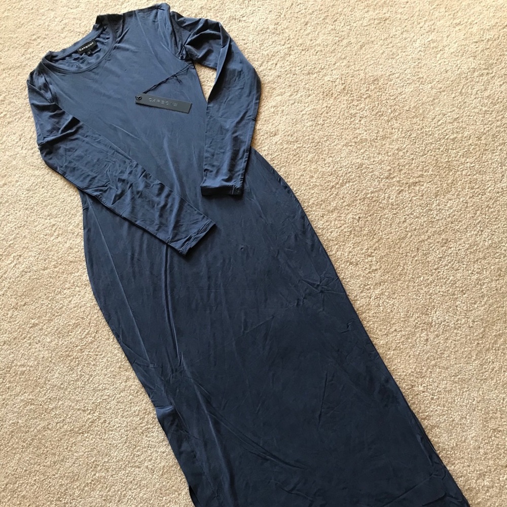 Long-sleeved, full-length, close-fitting dress.